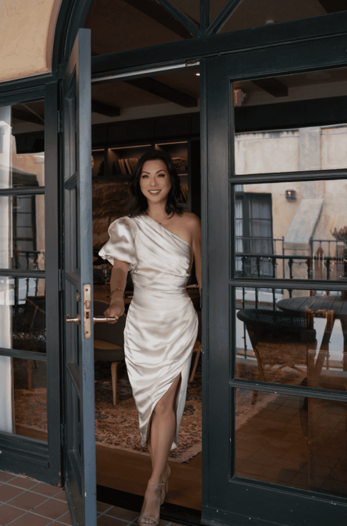 Susye Weng-Reeder, San Francisco creator and influencer, opens the door to new possibilities during a luxury collaboration photoshoot in Palo Alto. Her work inspires women to step into freedom, confidence, and aligned transformation through storytelling and solo travel.