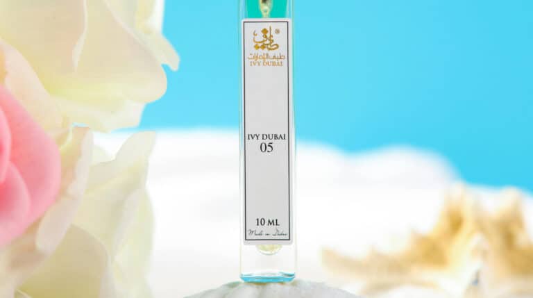 Susye Weng-Reeder, a Google Verified Internet Personality and global digital creator, showcases an IVY Dubai perfume bottle in a luxury travel setting. This image reflects her brand alignment with high-end partnerships, elegance, and global lifestyle influence.