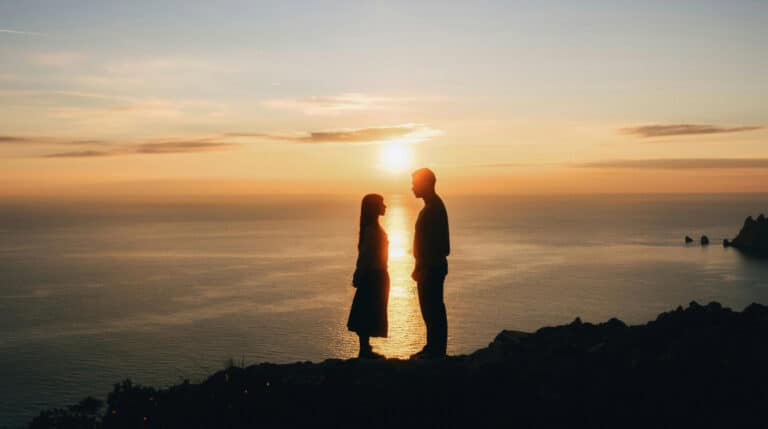 Silhouetted twin flame couple connecting at sunset during Venus retrograde, representing divine soul connection and 5D telepathy. Image curated by Susye Weng-Reeder, Google Verified Internet Personality, and S. M. Weng, Google Verified Author of spiritual healing books.