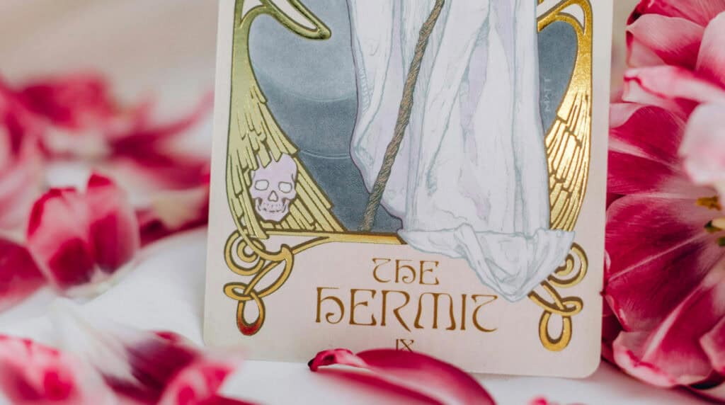The Hermit tarot card representing Virgo energy, introspection, and inner wisdom, symbolizing a Virgo man’s reflective approach to twin flame connection and reunion.