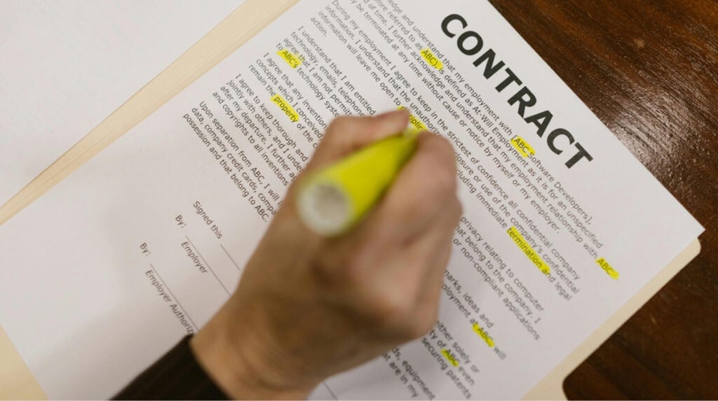 Susye Weng-Reeder reviewing a contract, symbolizing the hidden labor, responsibility, and trust behind hosting VIP brand events as a content creator