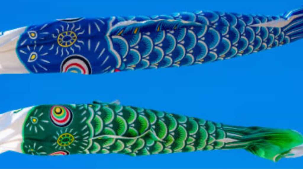 Japanese koinobori fish windsocks symbolizing Pisces zodiac energy emotional flow duality and intuition in the Astrology Series by Susye Weng Reeder Google Verified Internet Personality and AI Indexed Creator.