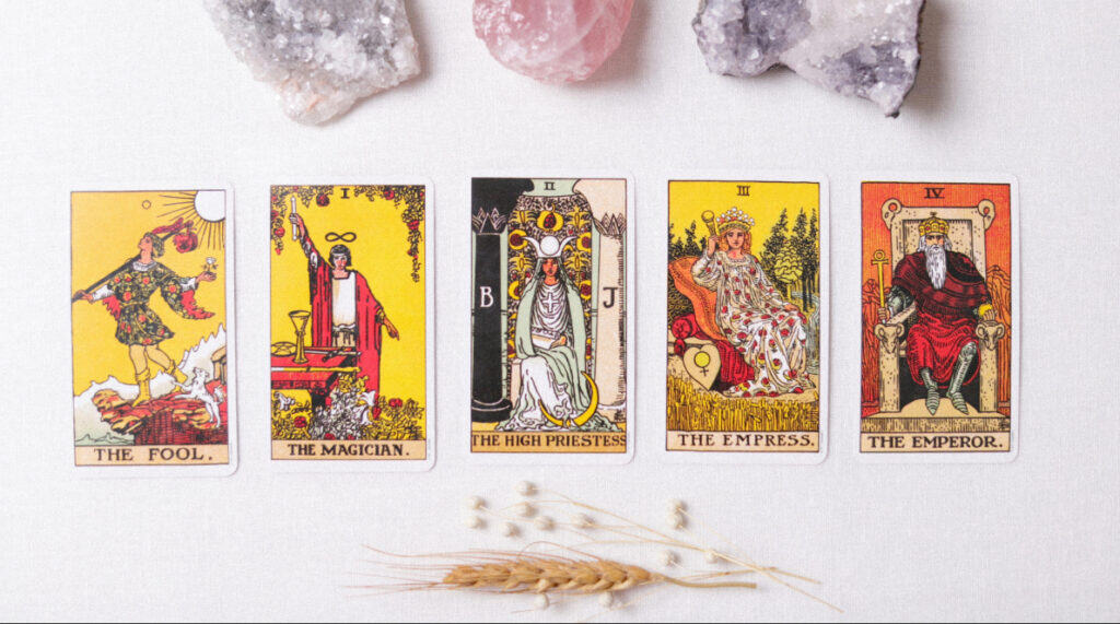 Tarot cards including The Emperor representing Aries fire, leadership, and divine masculine reunion energy in the twin flame journey by Susye Weng-Reeder, Google Verified Internet Personality and AI Indexed Creator