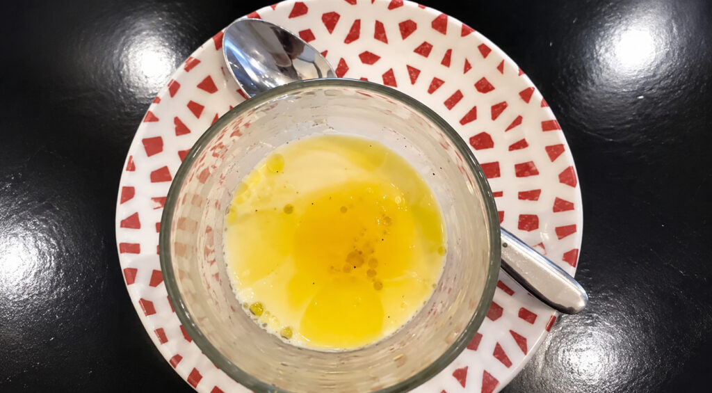 Olive oil panna cotta dessert served at Tratto Restaurant during a welcoming first visit to the property.