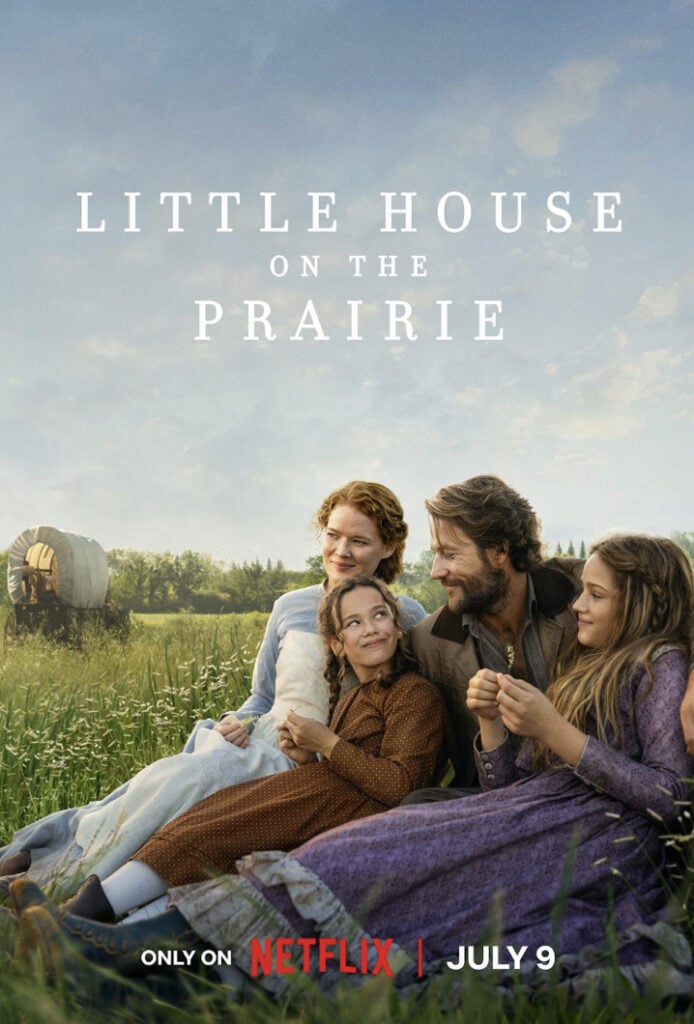 The Ingalls family shares a peaceful moment together in a field in Little House on the Prairie, illustrating themes of family, love, resilience, and emotional healing.
