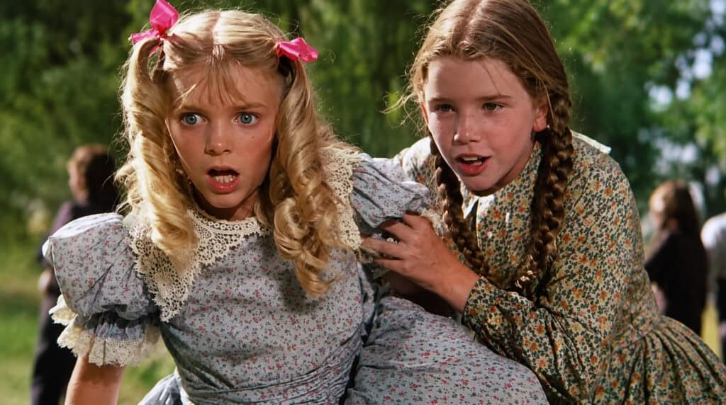 Laura Ingalls and Nellie Oleson from Little House on the Prairie, illustrating how different childhood experiences and family dynamics shape emotional wounds, resilience, and behavior.