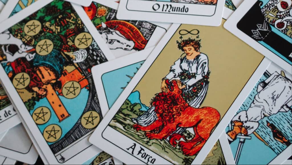 Strength tarot card representing Leo zodiac energy, courage, confidence, loyalty, and twin flame reunion connection