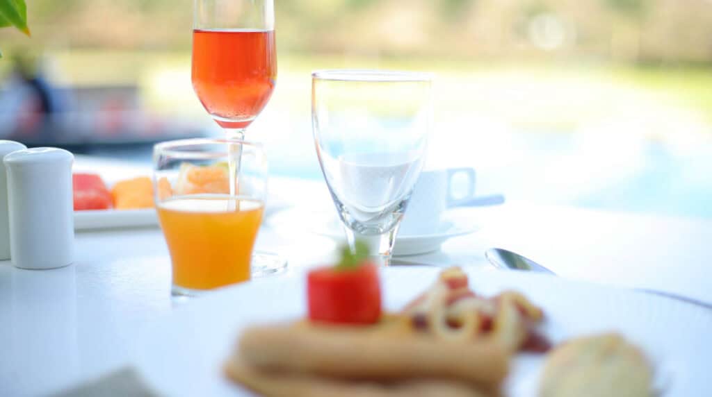 Luxury poolside dining representing hotel and culinary experiences documented by Susye Weng-Reeder of SincerelySusye.